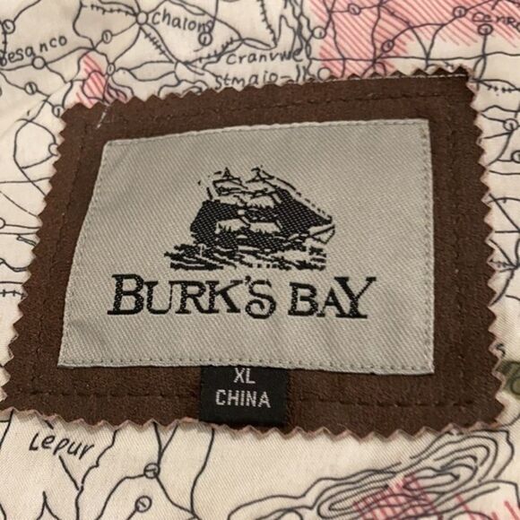 Burks Bay  leather brown coat has a patch on the left side. - Picture 6 of 8